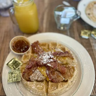 Chicken and Waffles with Cheese, Bacon and a side of Spicy Syrup.