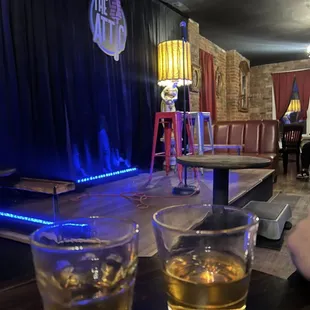 two glasses of whiskey on a table