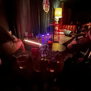 people sitting at a table with wine glasses