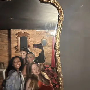 a group of people taking a selfie