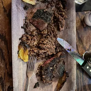 Ribeye and uncooked risotto.