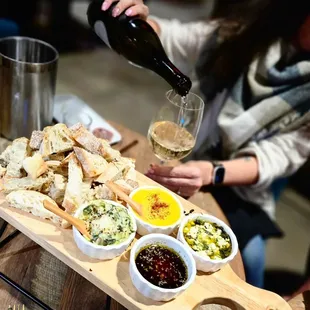 a woman pouring a glass of wine