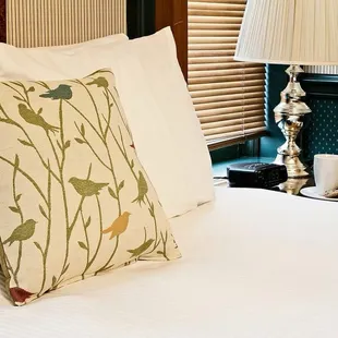 a bed with pillows and pillows