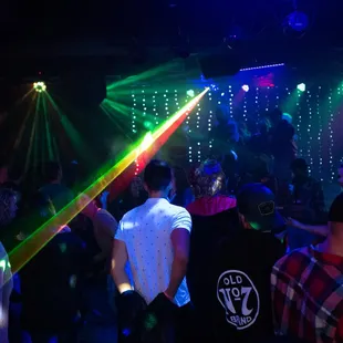 a group of people dancing in a club