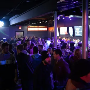 a large group of people in a bar