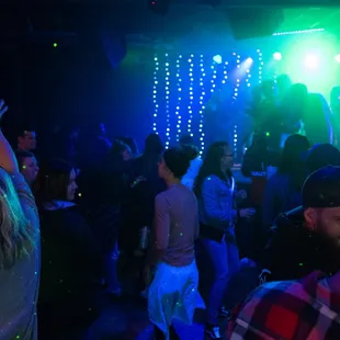 a group of people dancing at a party