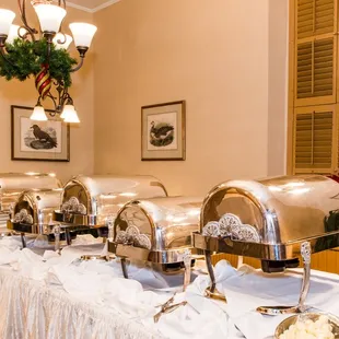a buffet table with a variety of food items