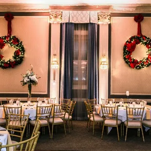 a formal dining room decorated for christmas
