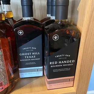 three bottles of red handed bourbon