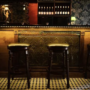 a bar with three stools