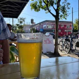 a glass of beer on a table