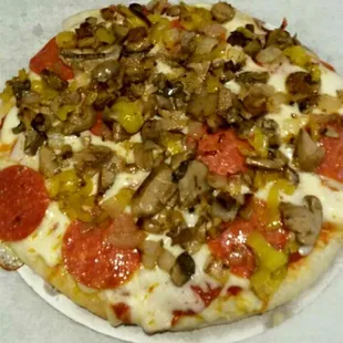 a pepperoni, mushroom, and cheese pizza