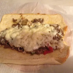a sandwich with meat and cheese