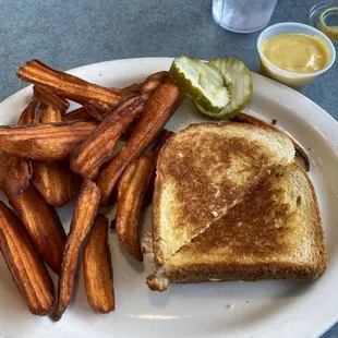 Grilled cheese with sweet potato fries and honey mustard sauce.