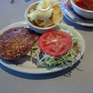 Turkey burger on whole wheat bun with cabbage soup and coffee.