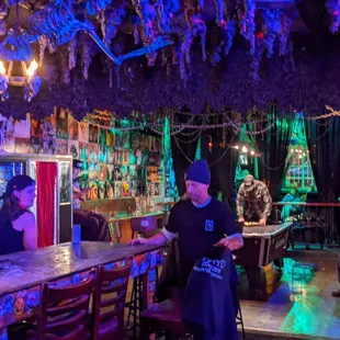 a man standing at a bar