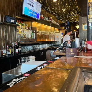 a bar with a man behind the bar