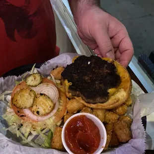 Cheese burger with everything on it.