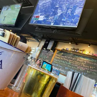 a glass of beer and a television