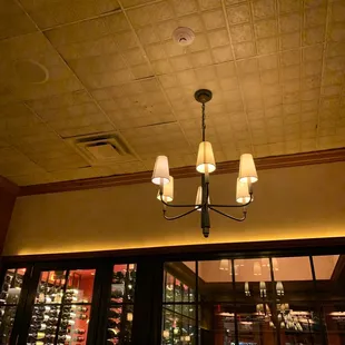 a chandelier and wine rack