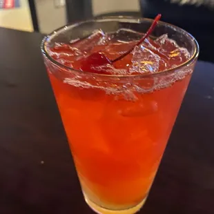 a drink in a glass on a table