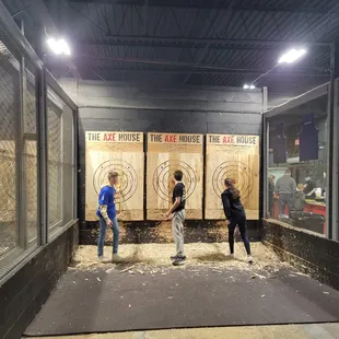The kids throwing  axes