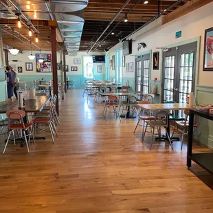  a restaurant with tables and chairs