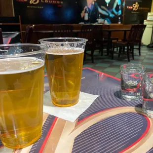 two glasses of beer on a table