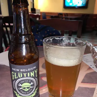 a glass of beer and a bottle