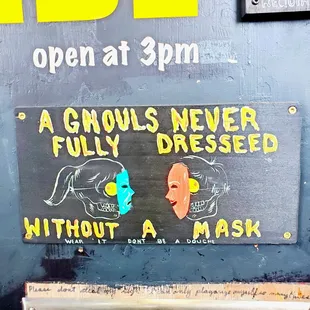 a sign for a clowns never fully dressed without a mask