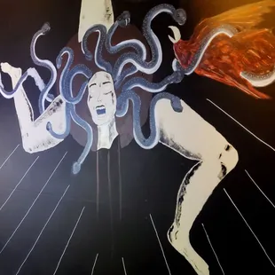 a painting of a woman with tentacles