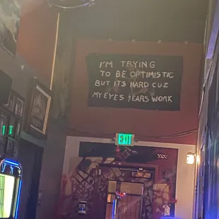 a sign that reads, i'm trying to be optimistic