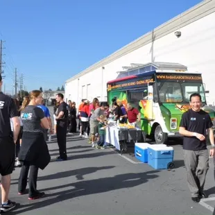 a large group of people standing in a parking lot