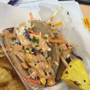 Flat bread taco filled with grilled vegetables and topped with chipotle aioli.