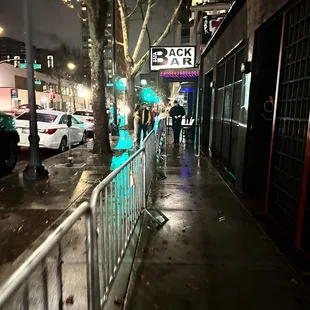 people walking down the sidewalk