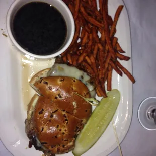 Prime rib sandwich with au jus and sweet potato fries