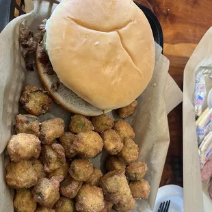 Brisket sandwich with fried okra.