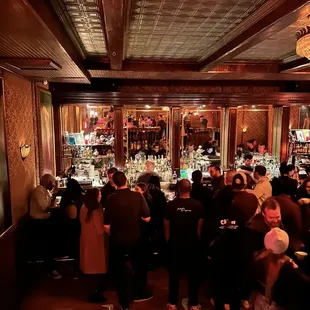 a crowd of people at a bar