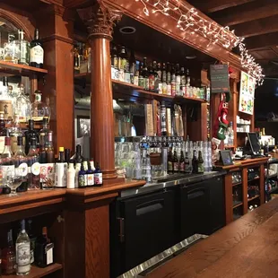 a bar with many bottles of alcohol