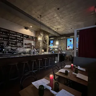 a restaurant with a bar and tables