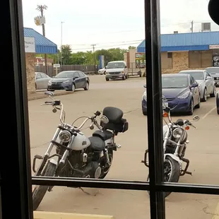 motorcycles parked in a parking lot