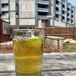a glass of beer on a table