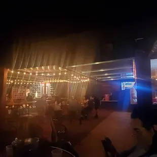 a blurry image of people sitting at tables