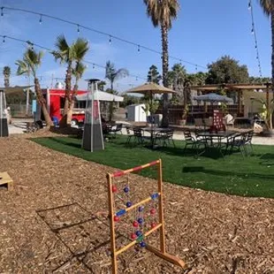 Pano of the grounds.  Two food trucks for ordering.  Lots of games and open space.  Heat lamps and night time lighting.