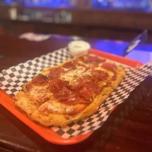 a slice of pepperoni pizza