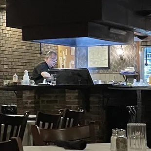 Watching the owner create the perfect steaks!