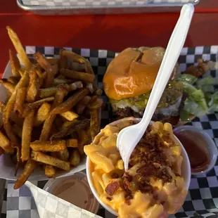 a tray of fries and macaroni and cheese