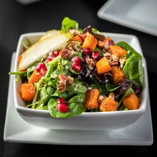 a plate of salad with a fork