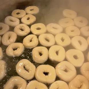 Boiling bagels fresh every day