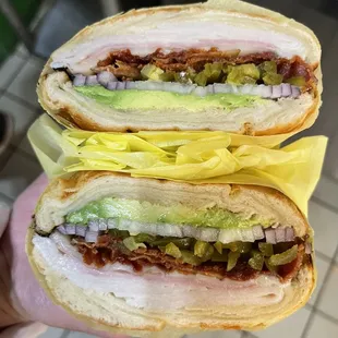 Turkey Ham Bacon Avocado jalapeño Red onion and cheese on the croissant